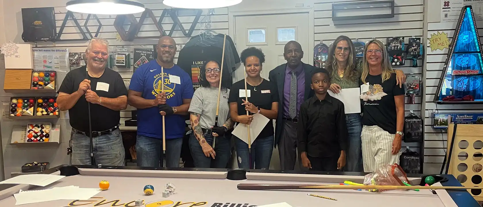 Diverse group of smiling pool school participants