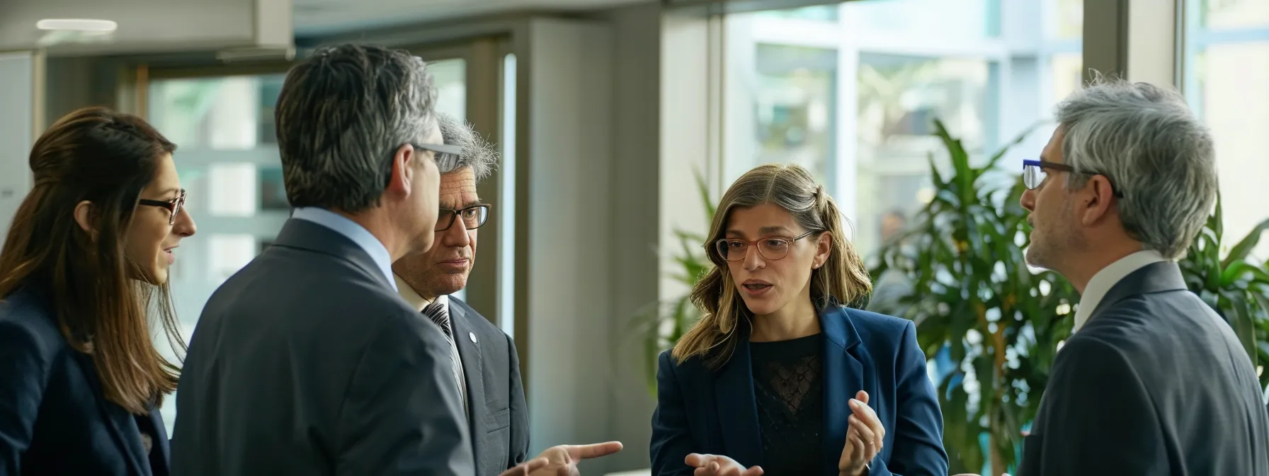 group of business professionals discussing the benefits of ipamorelin versus mk-677 for growth hormone stimulation.