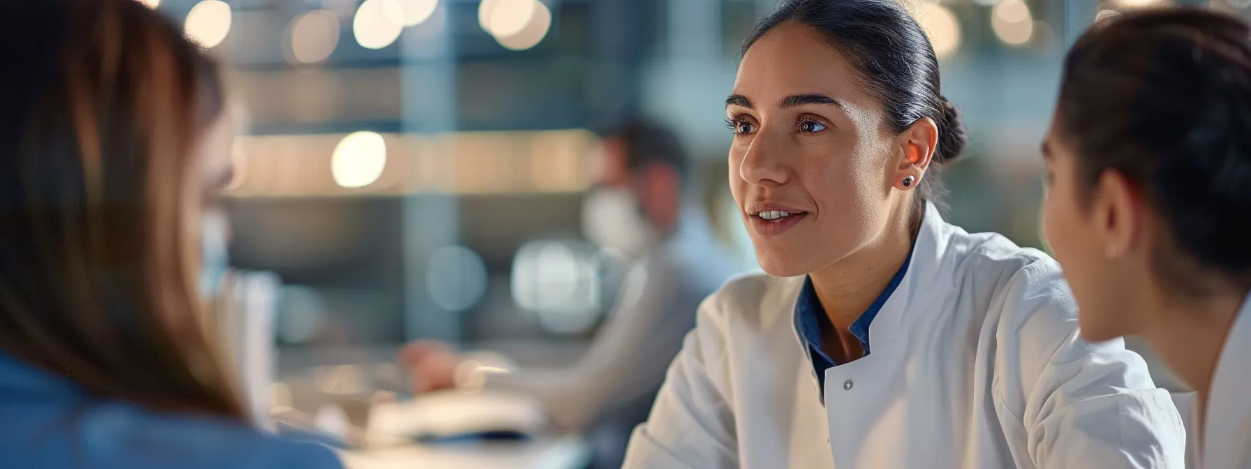 business professionals are engaged in a focused discussion about microneedling enhancements.