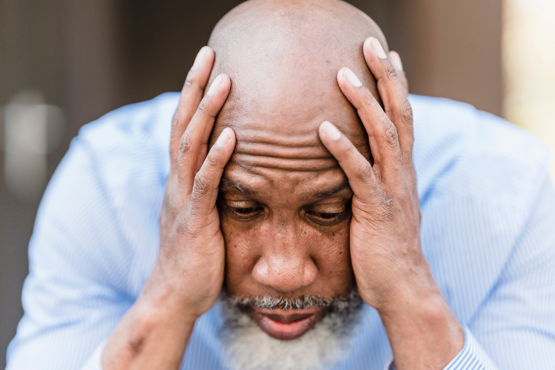 Man holding his head in stress