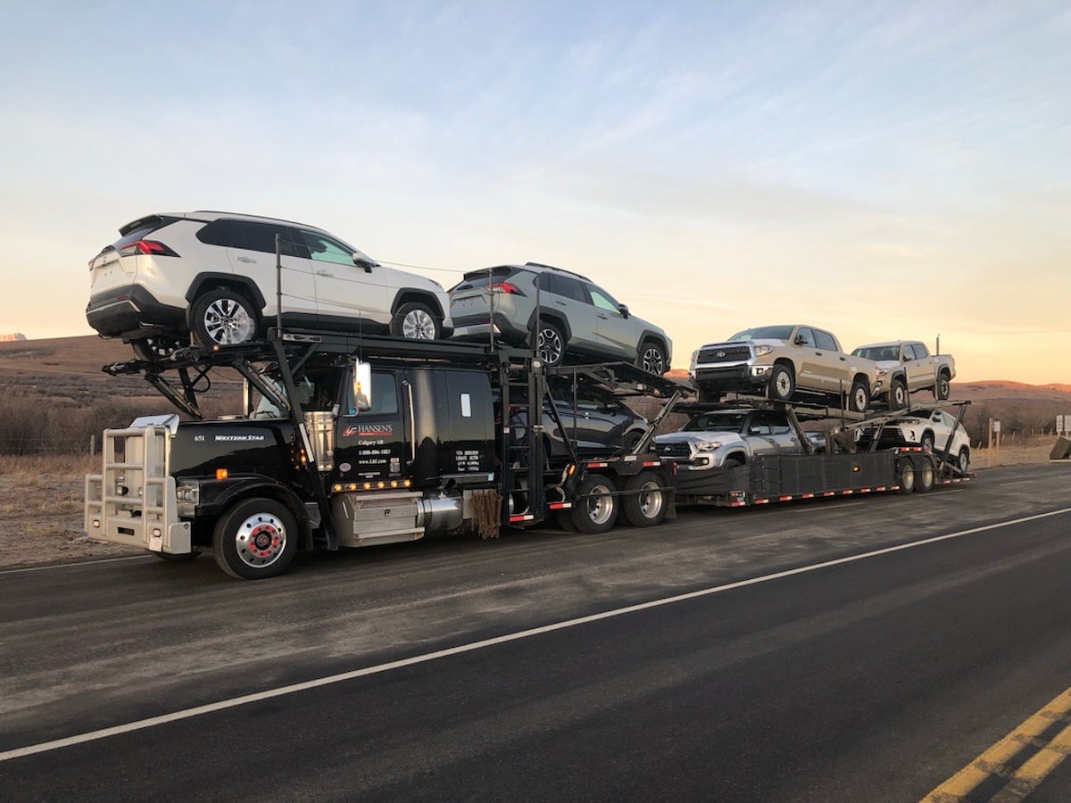 Hansen's auto carrier parked on side of the road