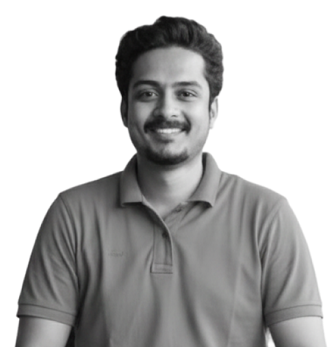 Smiling man with short hair and a mustache wearing a polo shirt on a transparent background.