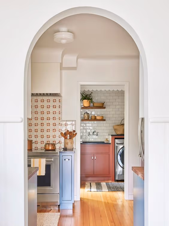 Small kitchen with colorful appliances and vibrant accents