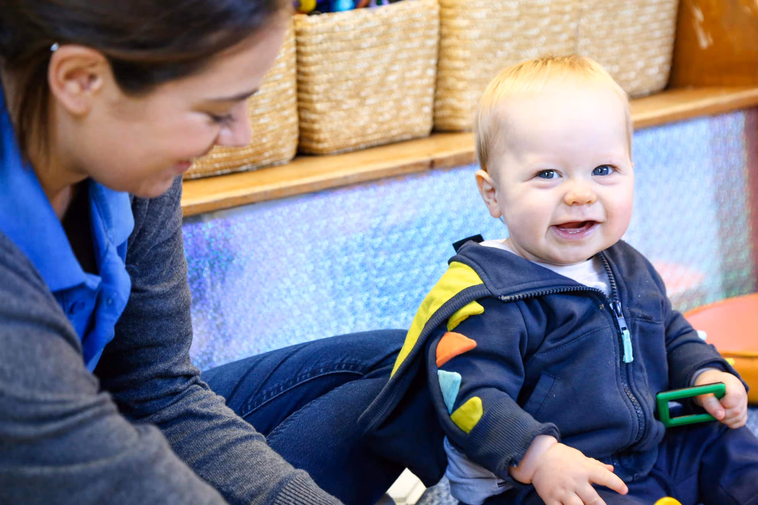 Teacher and child laughing with each other