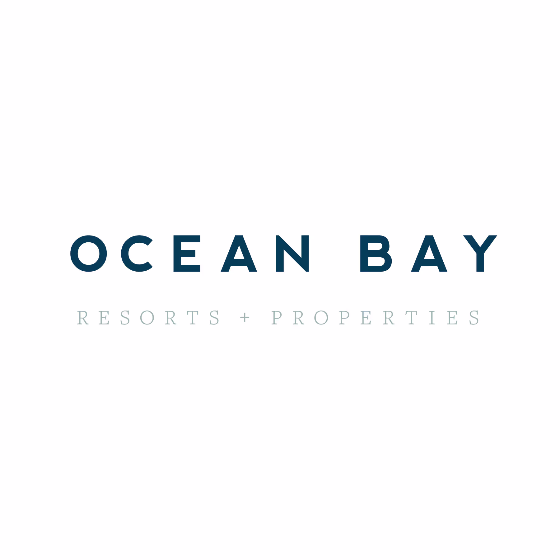 Ocean Bay Resorts + Properties logo with text in dark and light blue font on white background.