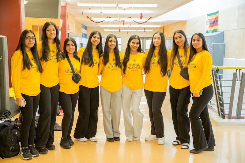 Group of girls in Royal Academy yellow long sleeve shirts
