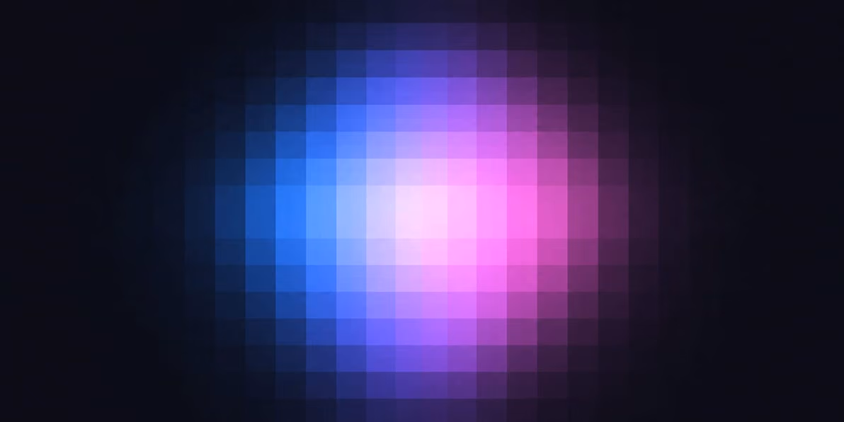 Blurry pixelated circle with blue on left and pink on right on a dark background.