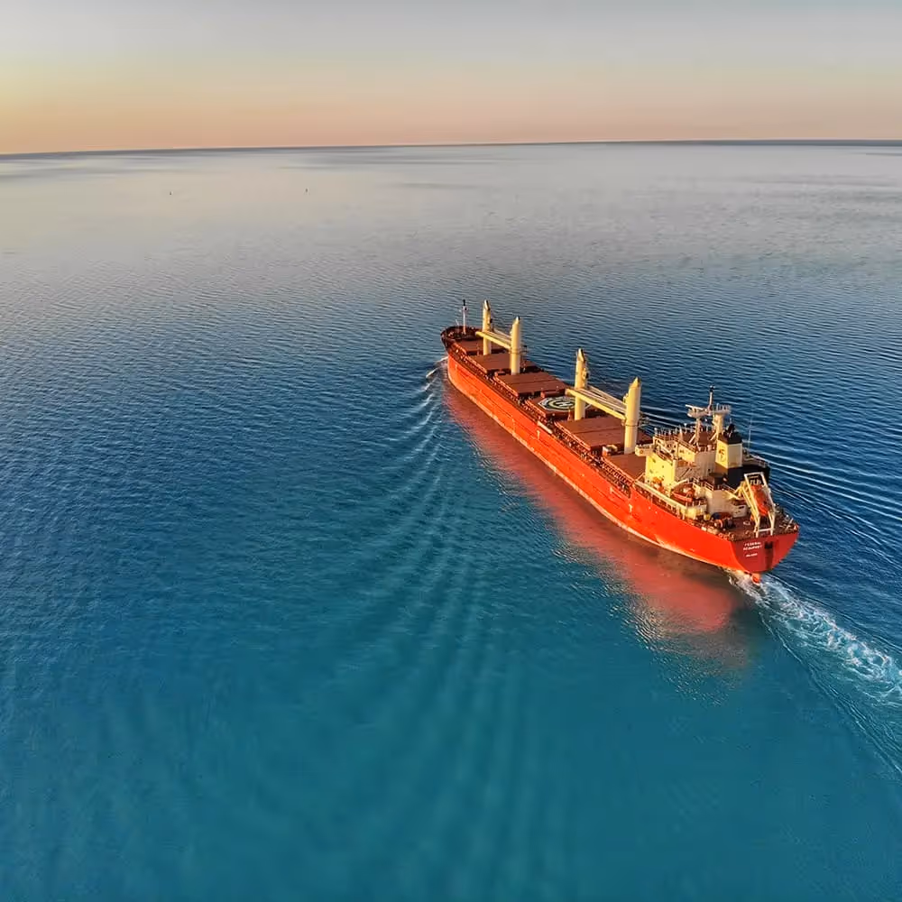 A ship carrying containers filled with goods.
