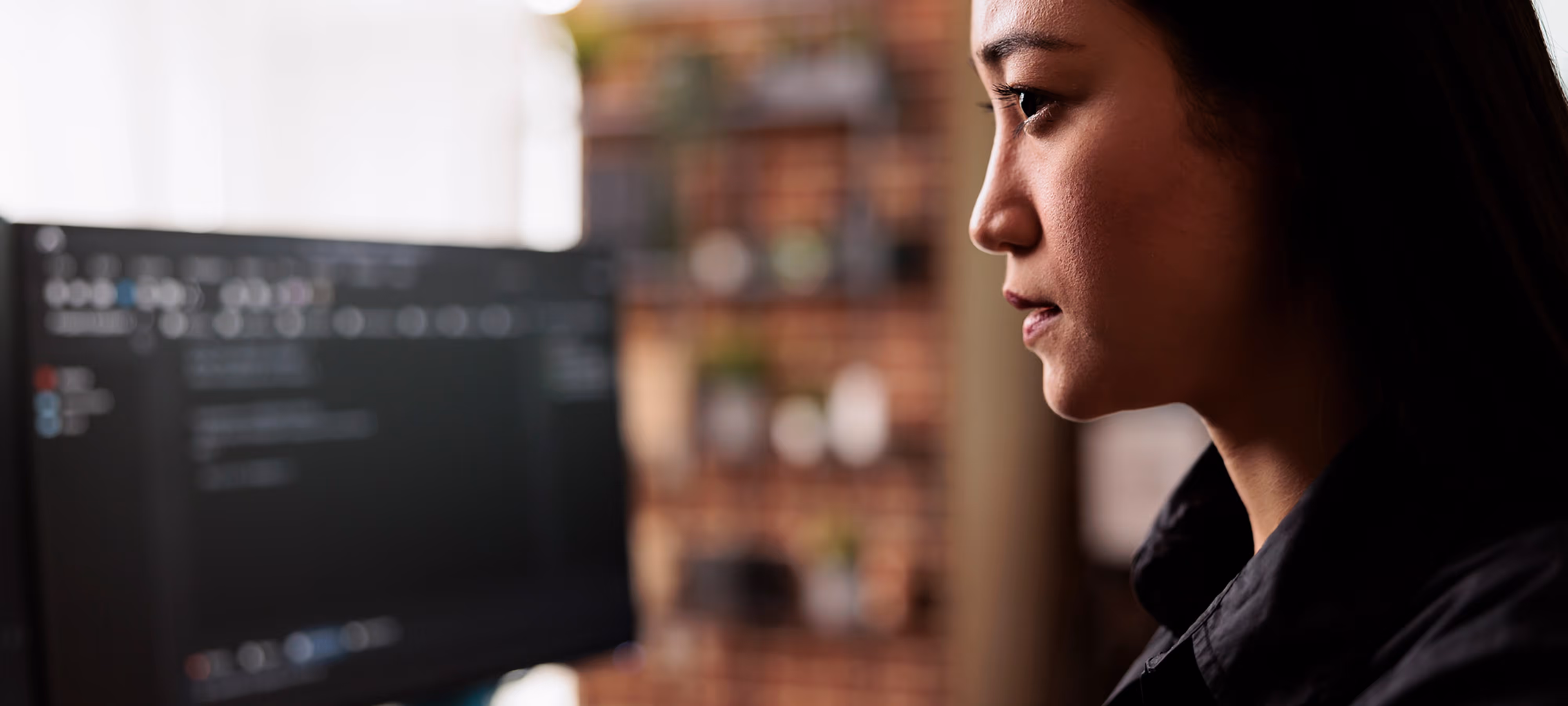 A woman looking at her computer.