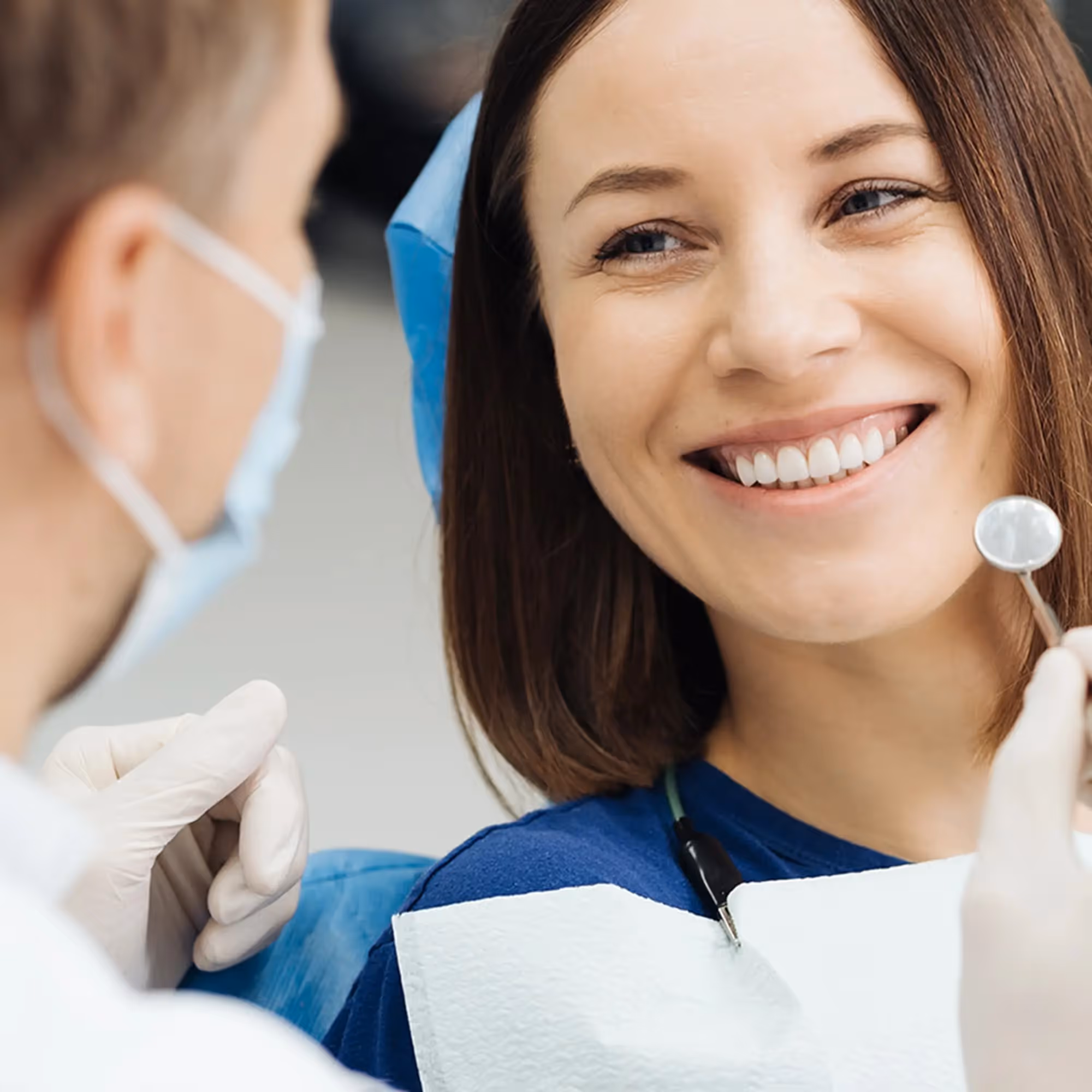 A woman interacting with a dentist.