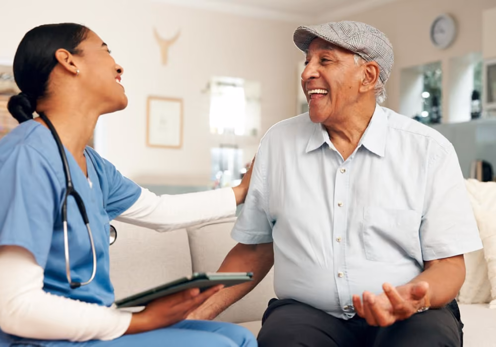 A doctor talking to a patient and telling him good news.