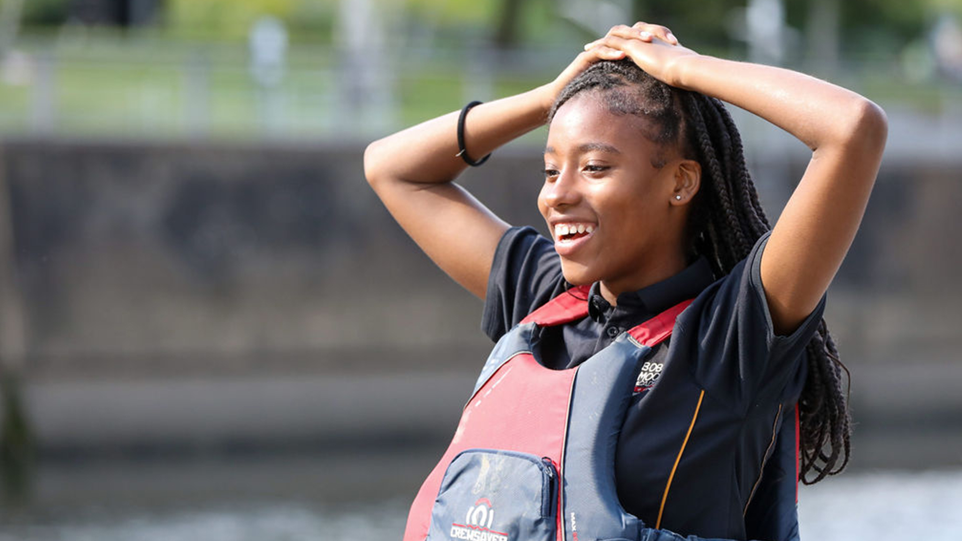 Smiling active row participant in lifejacket