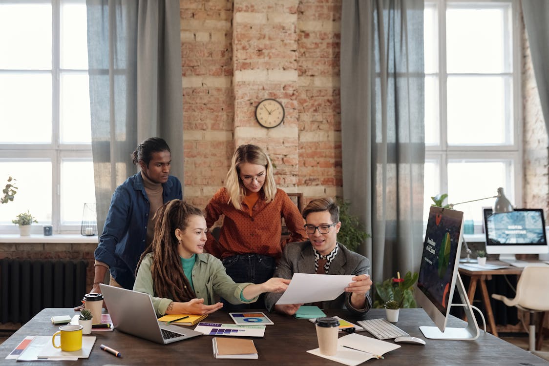 Free A Group of People Discussing Marketing Plans Stock Photo