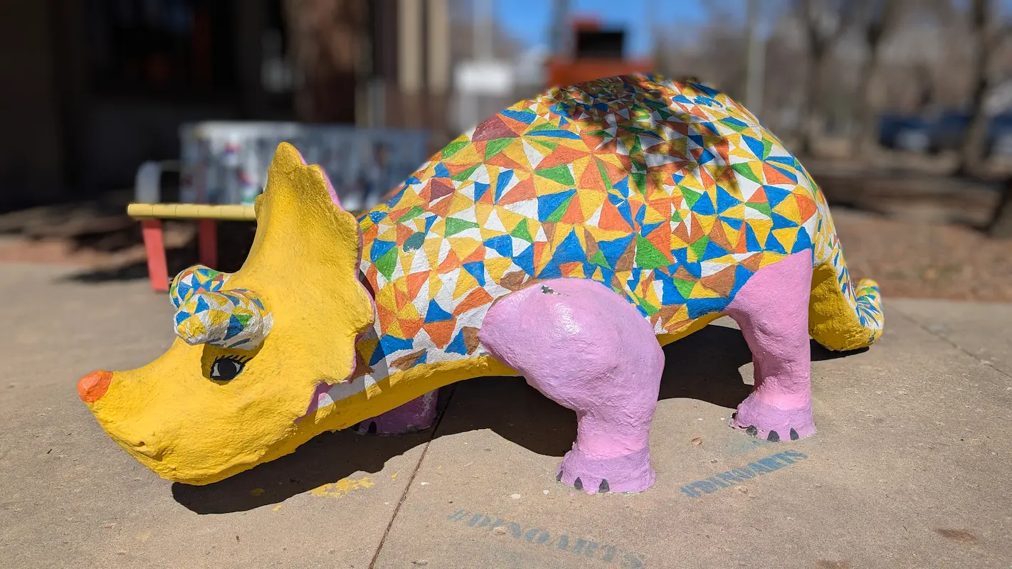 A image of a dinosaur statue Ted