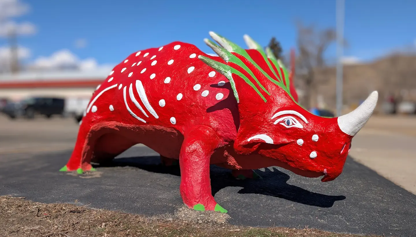 A image of a dinosaur statue Val