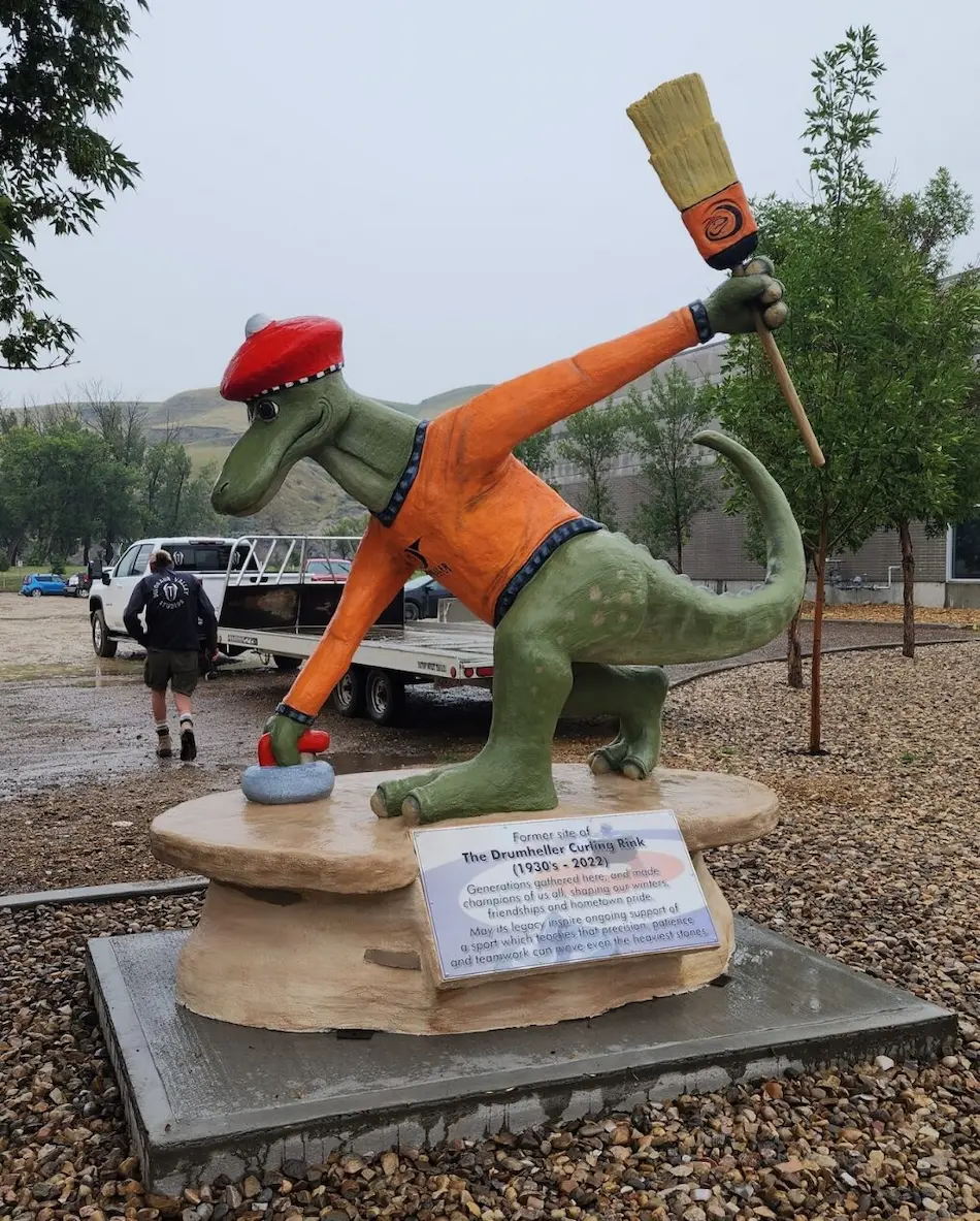 A image of a dinosaur statue Curly