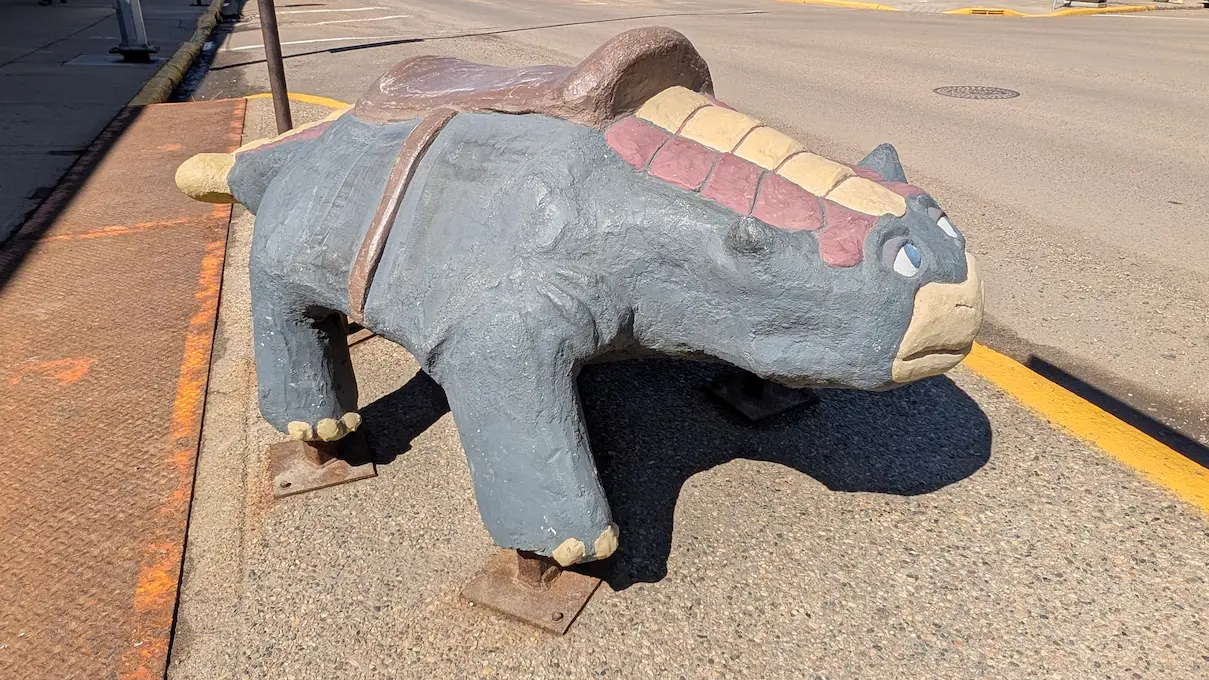 A image of a dinosaur statue Shamus