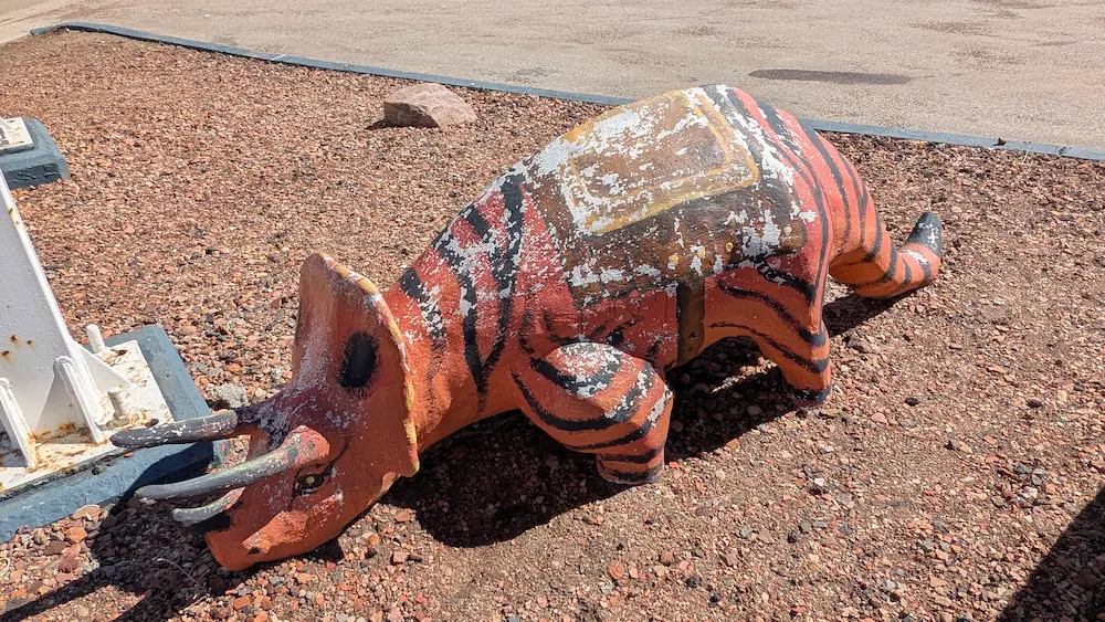 A image of a dinosaur statue Fay