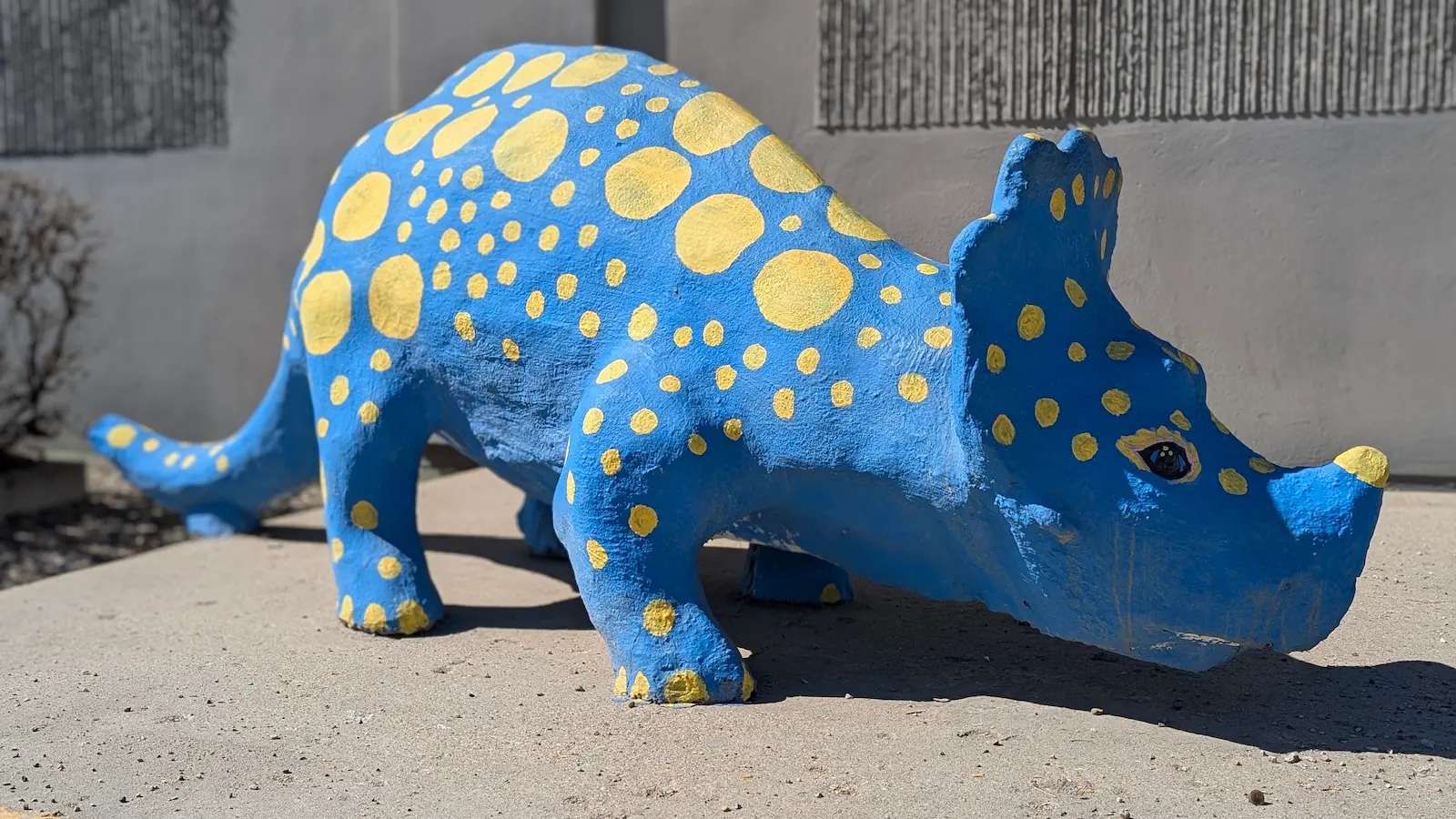 A image of a dinosaur statue Spot