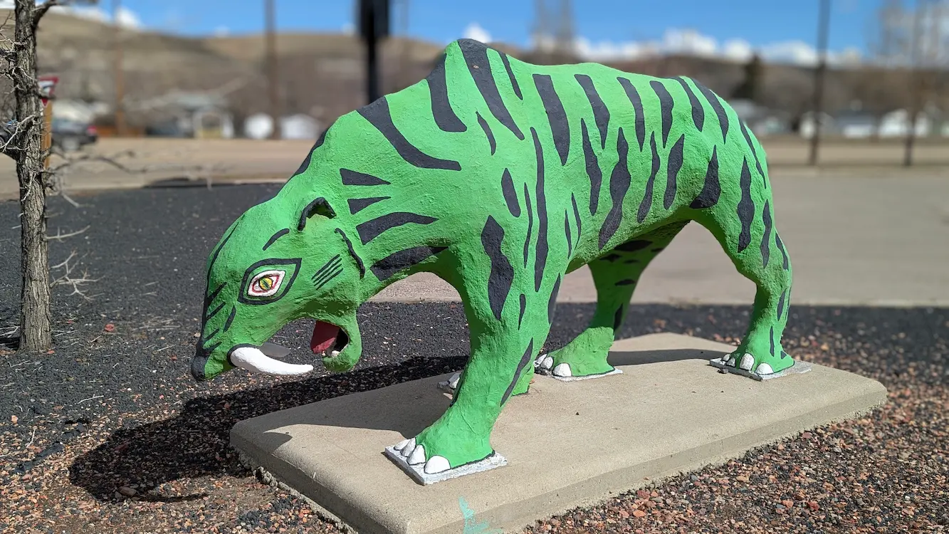 A image of a dinosaur statue Charlie