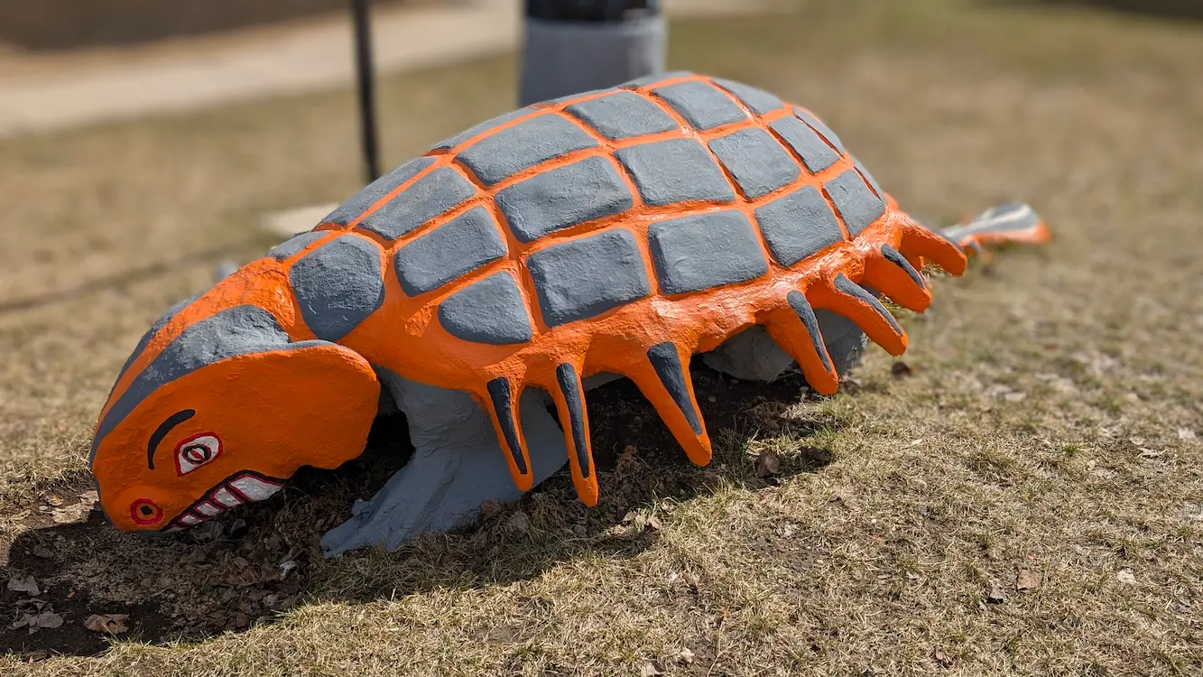 A image of a dinosaur statue Champ