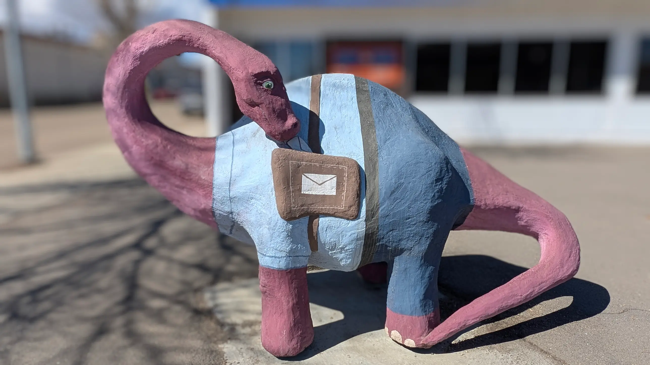 A image of a dinosaur statue Paul