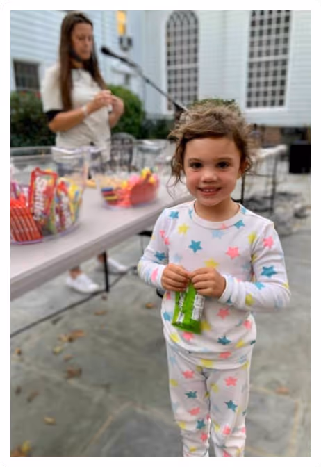 image of a little girl smiling at Towerhill church's volunteer even