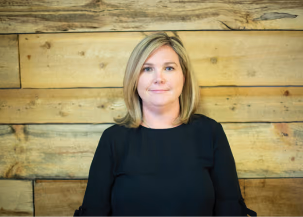 A blonde lady smiling at the camera at Tower Hill First Presbyterian Church