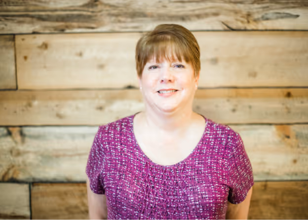 Photo of a lady with pixie haircut smiling at Tower Hill First Presbyterian Church