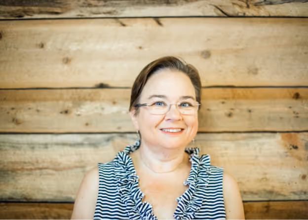 Photo of a lady with eyeglasses smiling at Tower Hill First Presbyterian Church