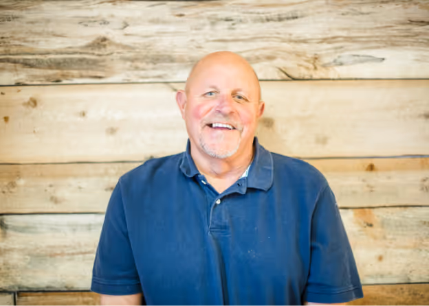 Photo of a man wearing a dark blue shirt smiling at Tower Hill First Presbyterian Church