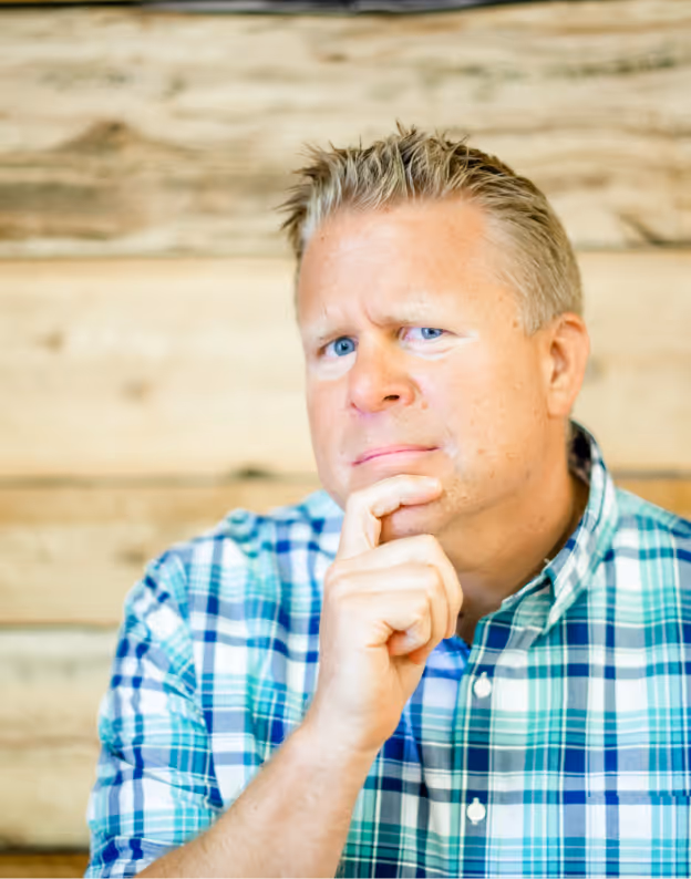 Jason Tucker in a blue striped long sleeve posing for the camera at Tower Hill First Presbyterian Church