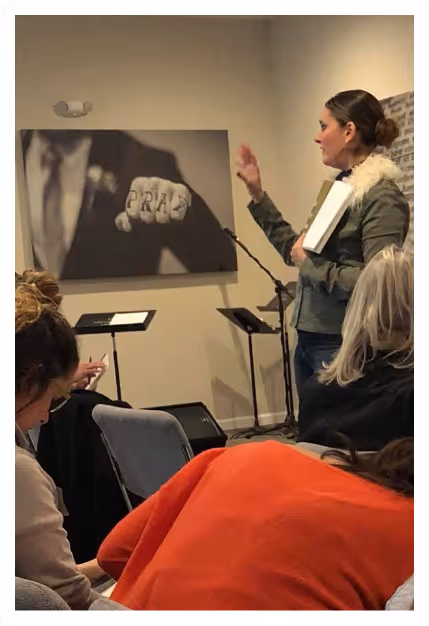 image of a small group session where a woman is presenting on tv screen while others watching