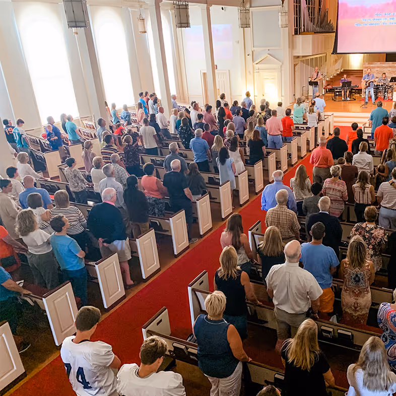 image of people listening to a traditional service at towerhill church