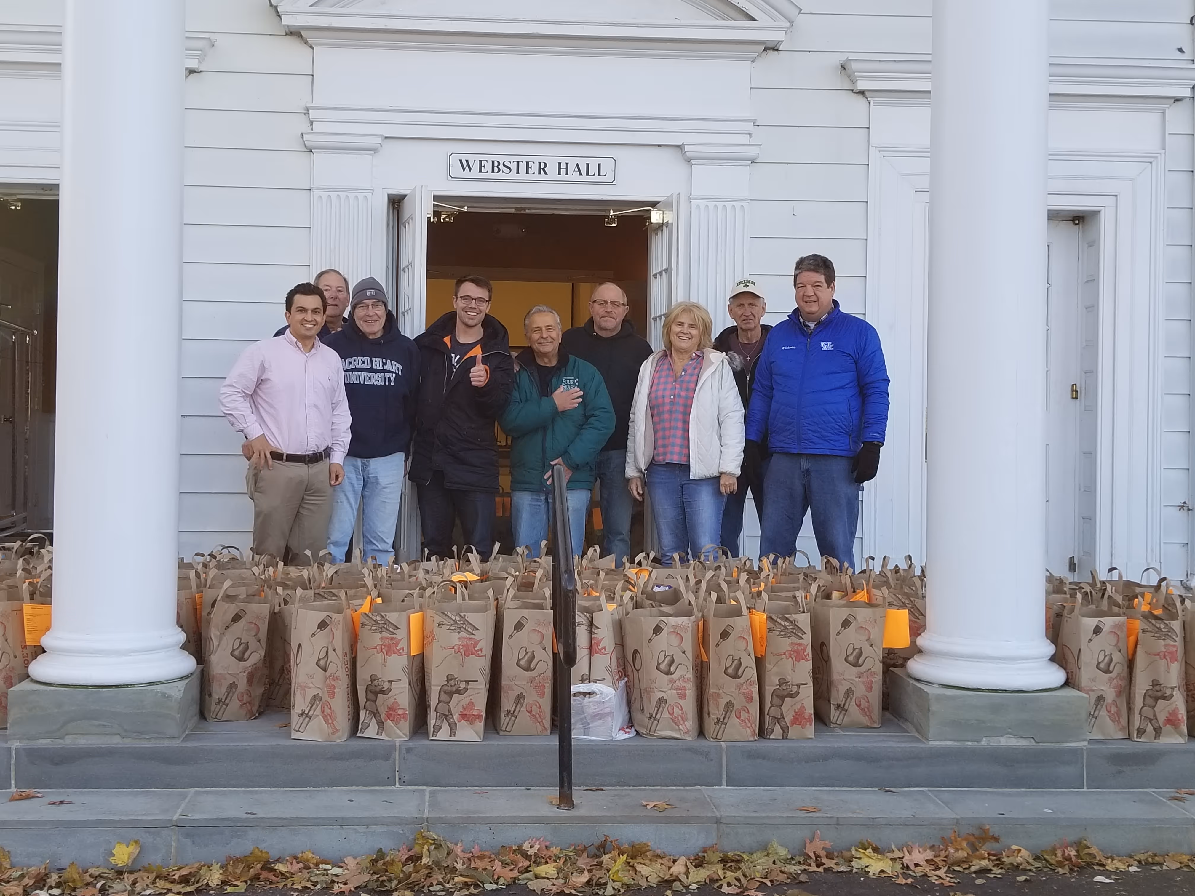 image of a group of people posing infront of groceries at towerhill church