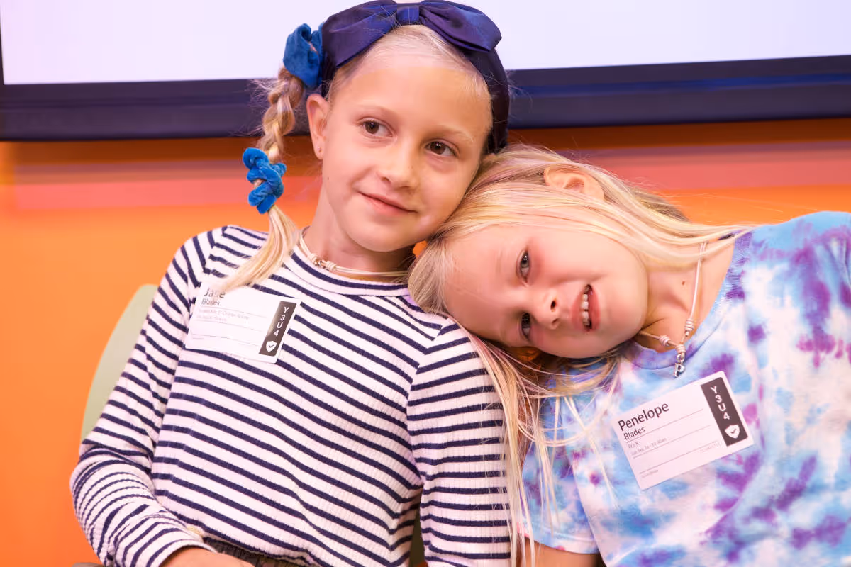 image of a kid sliding down in a cheerful way