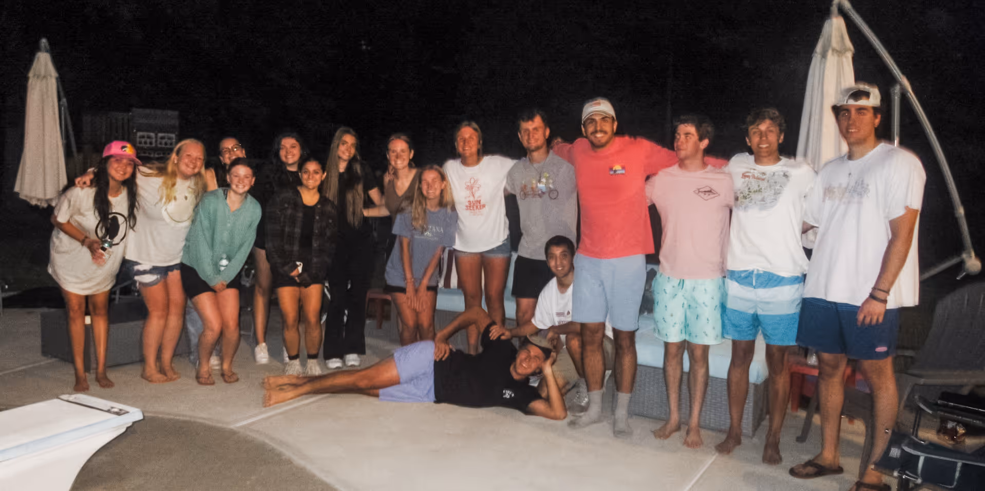 image of a group of young adults in a cricle playing with colors at towerhill church