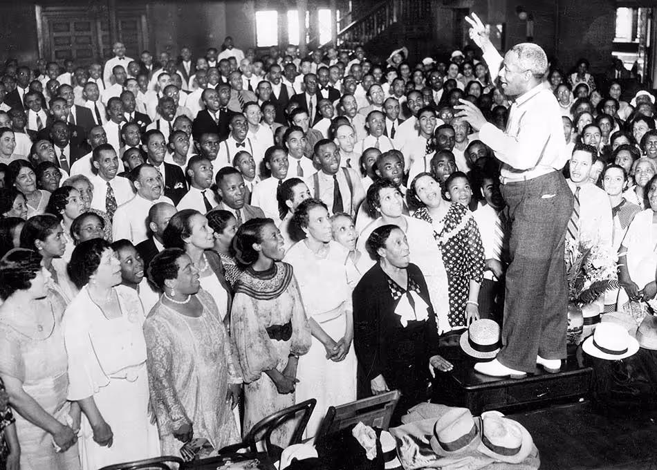 J. Wesley Jones, choral director, leads choir through a rehearsal at the Metropolitan Community Church in Chicago in August 1935.