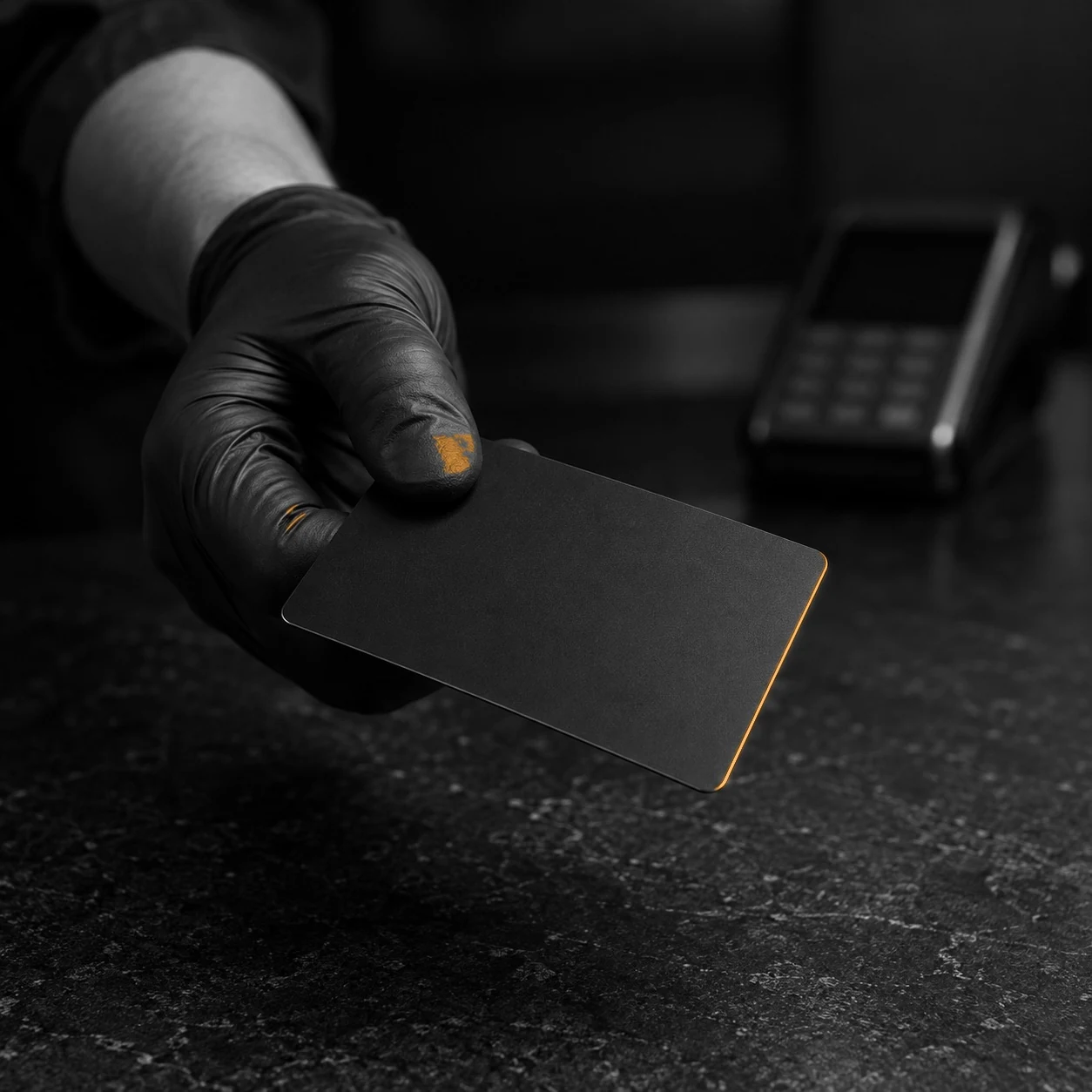 A payment card and terminal on a clean reception counter in a hair removal studio