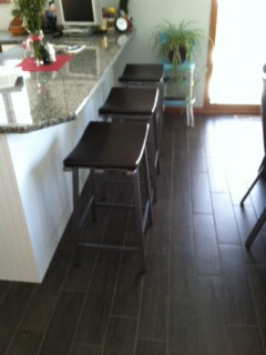 three black saddle kitchen stools