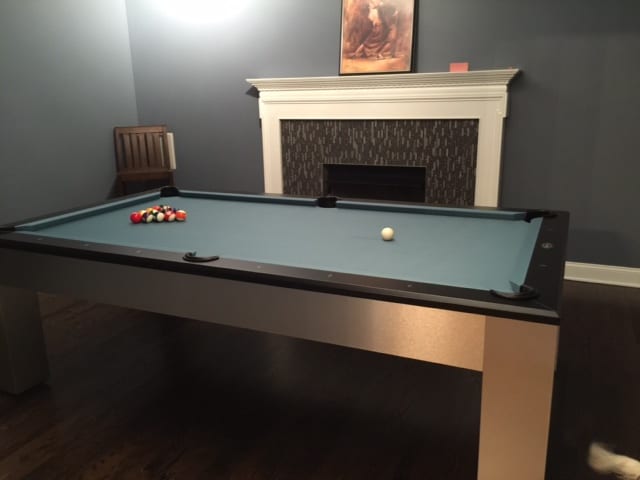 green pool table with fireplace