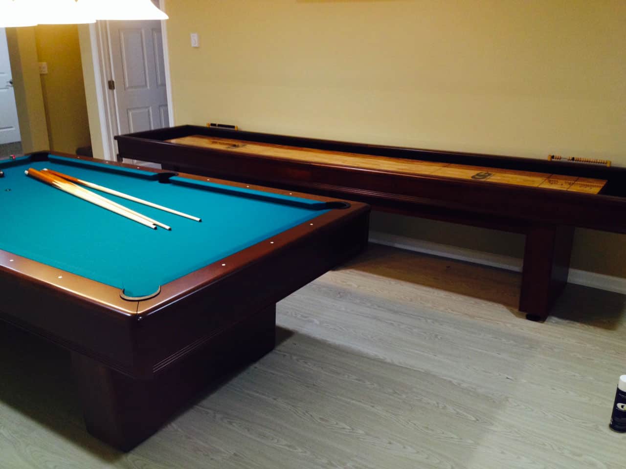 green pool table and shuffleboard