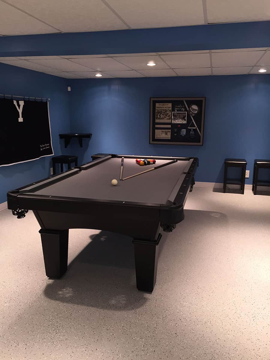 black pool table in a blue room