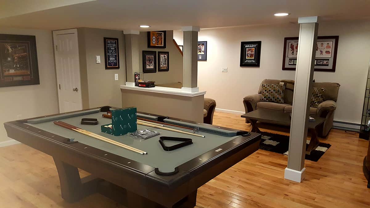 green pool table in a basement