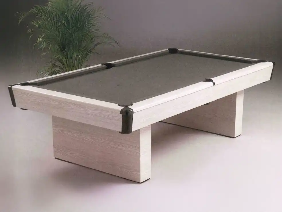 The Brunswick Ashcroft 8-foot pool table with a rustic grey finish in a modern game room. It features sturdy, tapered legs and black leather pockets.