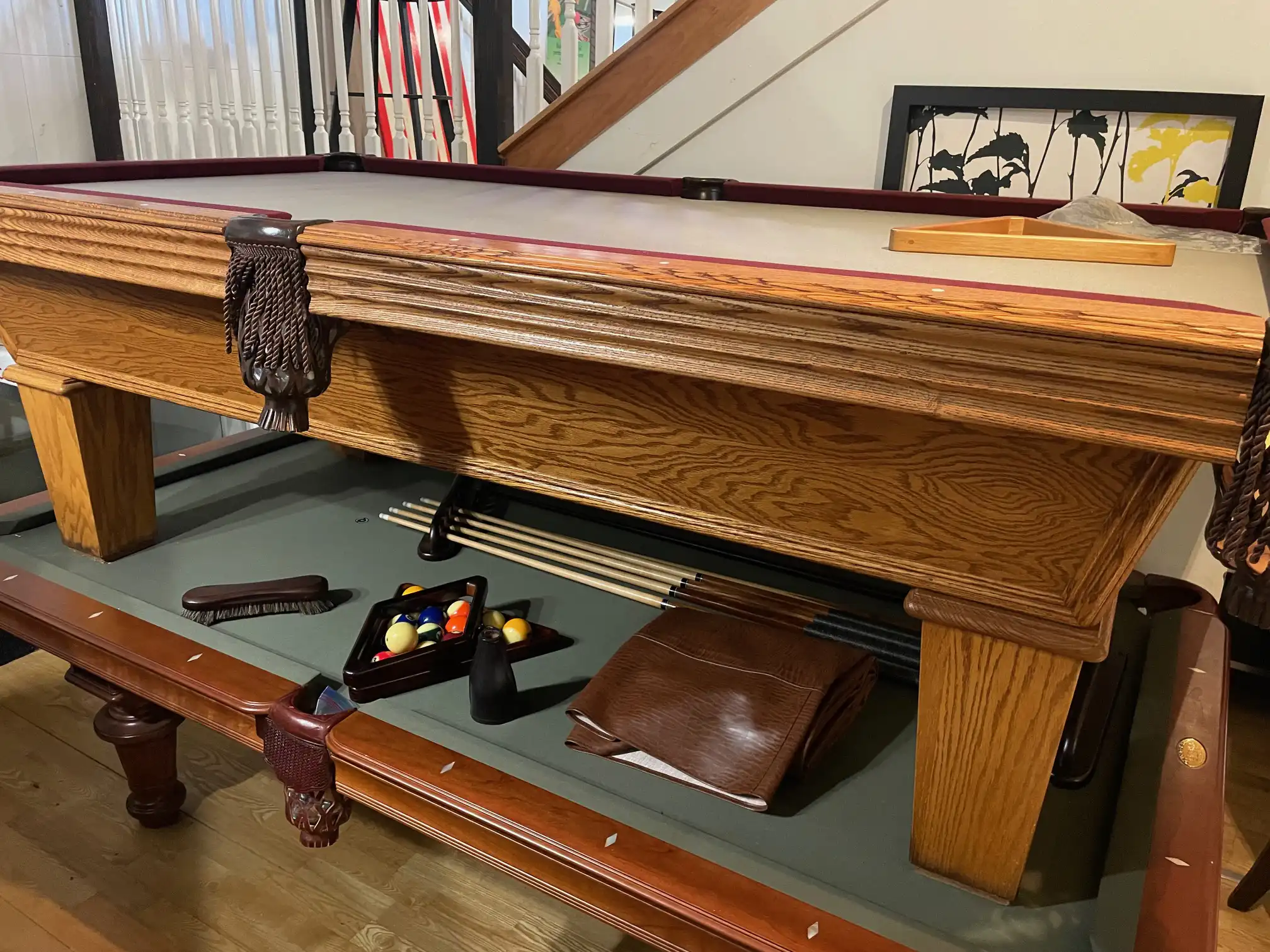 Oak Olhausen Provincial 8 pool table featuring a detailed drake-leg carving and green felt playing surface