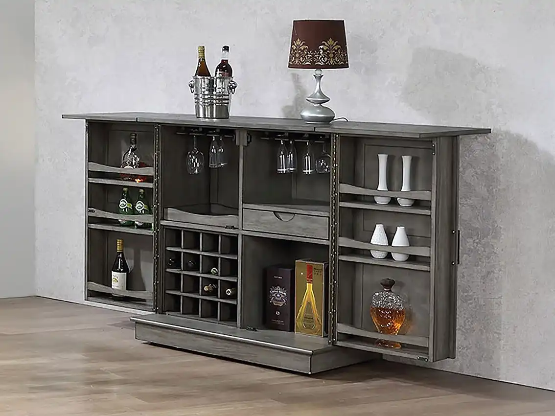 Open ECI Graystone Expandable Bar cabinet in a living space, featuring wine bottle racks, stemware holders, and side shelving for liquor and decor.