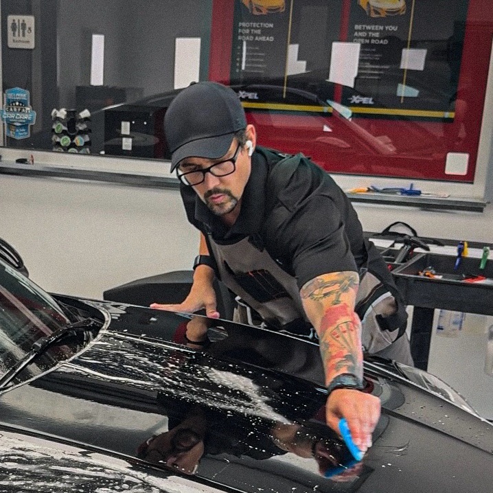 Paint Protection Film being installed on the hood of a Tesla Model Y