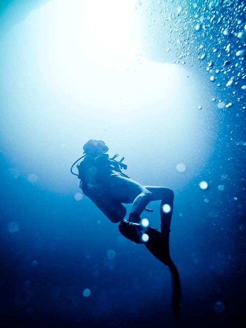 A scuba diver's silhouette in Blue Hole, Palau