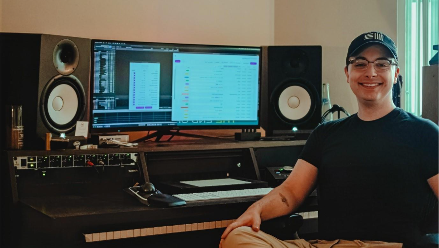 A person sitting in front of a computerDescription automatically generated